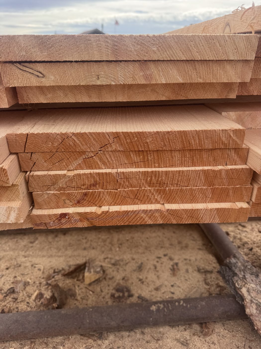 Stack of rough-sawn Doug fir showing true-dimension end grain
