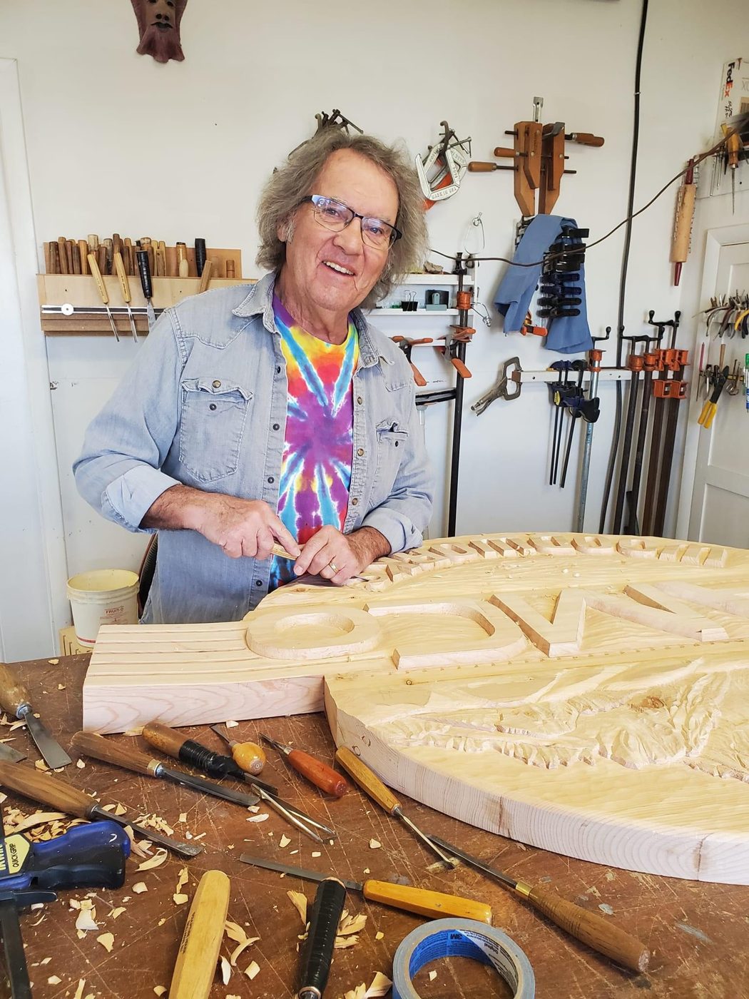 Denny carving the JAMCo sign